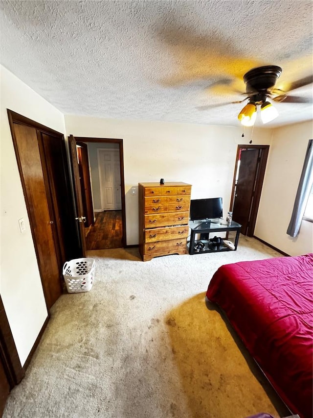 308 N Ellen St, Dixon, MO 65459 - bedroom featuring carpet flooring, a textured ceiling, ceiling fan, and baseboards