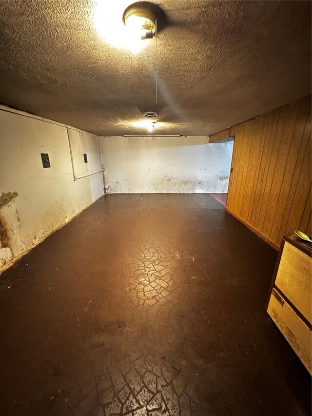 308 N Ellen St, Dixon, MO 65459 - below grade area featuring a textured ceiling and wooden walls