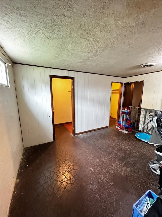 308 N Ellen St, Dixon, MO 65459 - unfurnished living room featuring a textured ceiling