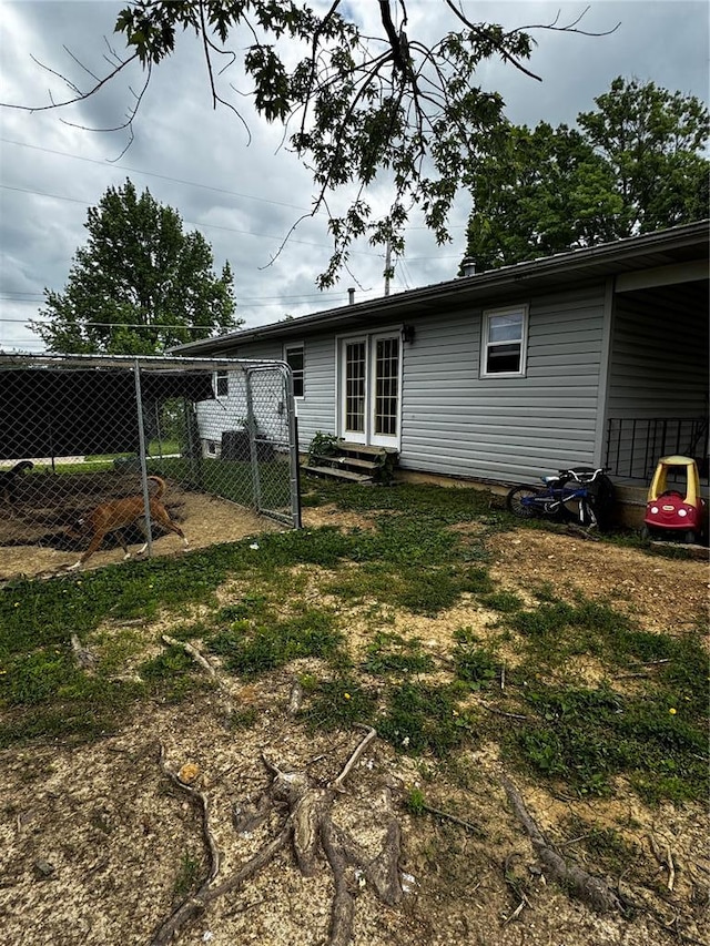 308 N Ellen St, Dixon, MO 65459 - back of property with entry steps and a gate