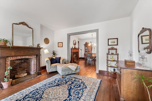 100 W Alton St, Marine, IL 62061 - living area featuring a fireplace, wood finished floors, and baseboards