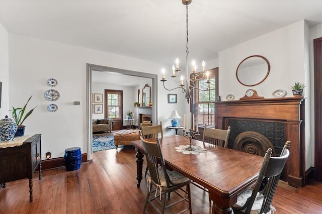 100 W Alton St, Marine, IL 62061 - dining space with a tile fireplace, healthy amount of natural light, wood finished floors, and a chandelier