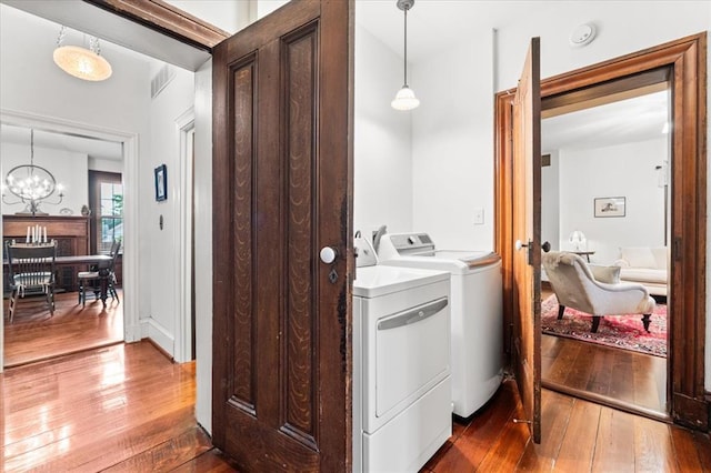 100 W Alton St, Marine, IL 62061 - laundry area with washer and clothes dryer, dark wood-style flooring, and a chandelier