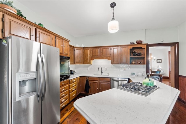 100 W Alton St, Marine, IL 62061 - kitchen featuring stainless steel appliances, a sink, a peninsula, light countertops, and dark wood finished floors