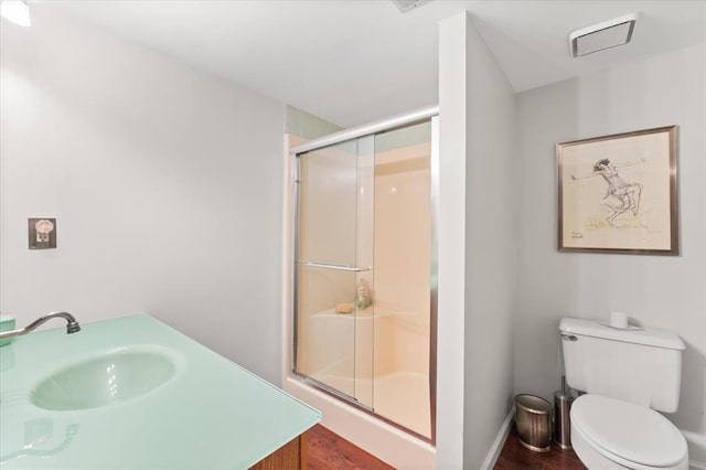 100 W Alton St, Marine, IL 62061 - bathroom featuring a sink, a stall shower, wood finished floors, and toilet