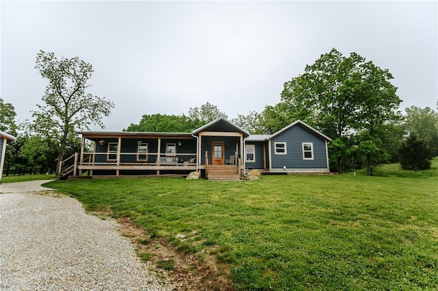 ranch-style home with a front yard, a porch, and driveway