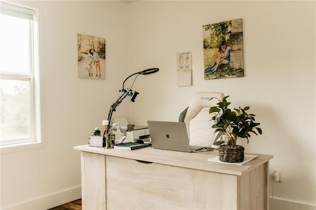 office space featuring baseboards