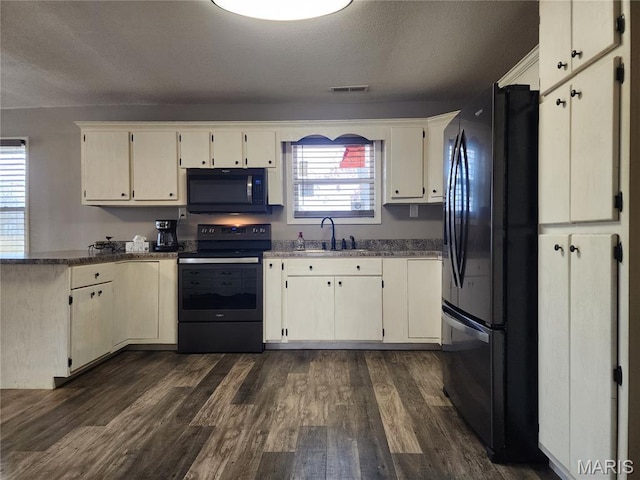 342 Deer Run Acres A, Williamsville, MO 63967 - kitchen with black appliances, a peninsula, a sink, dark wood-type flooring, and a textured ceiling