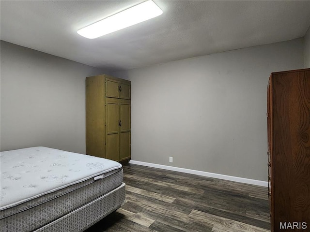 342 Deer Run Acres A, Williamsville, MO 63967 - bedroom featuring dark wood-style floors and baseboards