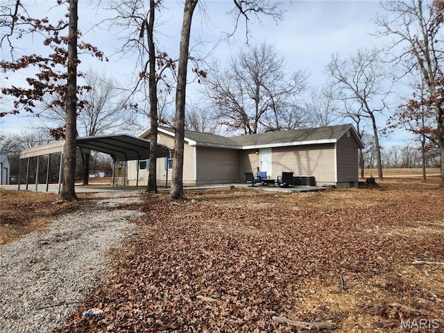 342 Deer Run Acres A, Williamsville, MO 63967 - view of property exterior with a detached carport and gravel driveway