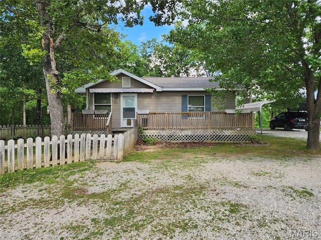 342 Deer Run Acres A, Williamsville, MO 63967 - view of front of house with a fenced front yard, covered porch, and a detached carport