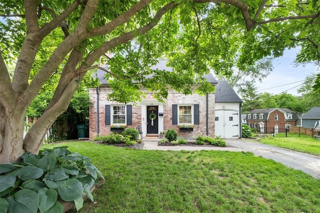 301 Dawson Ct, Webster Groves, MO 63119 - view of front of home with brick siding, a shingled roof, asphalt driveway, and an attached garage