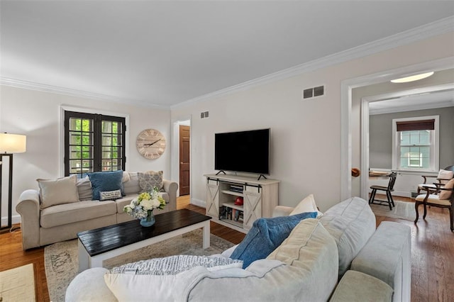 301 Dawson Ct, Webster Groves, MO 63119 - living area featuring crown molding, wood finished floors, and baseboards