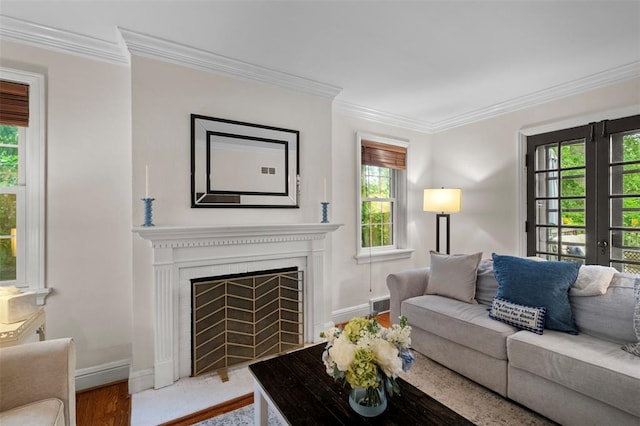 301 Dawson Ct, Webster Groves, MO 63119 - living area featuring wood finished floors, healthy amount of natural light, ornamental molding, and a fireplace with flush hearth