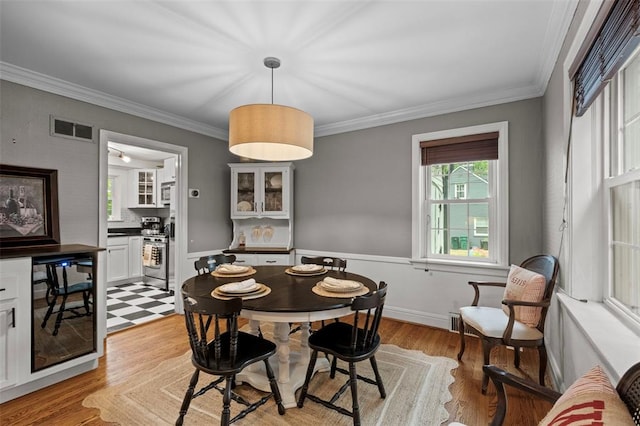 301 Dawson Ct, Webster Groves, MO 63119 - dining space with crown molding and light wood finished floors