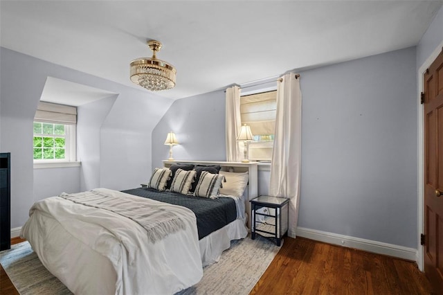 301 Dawson Ct, Webster Groves, MO 63119 - bedroom featuring wood finished floors, baseboards, and vaulted ceiling