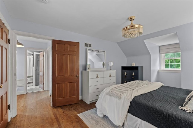 301 Dawson Ct, Webster Groves, MO 63119 - bedroom with wood finished floors and vaulted ceiling