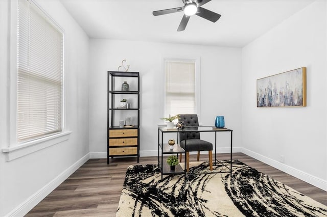 office with a ceiling fan, wood finished floors, and baseboards