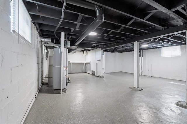 basement featuring gas water heater and plenty of natural light