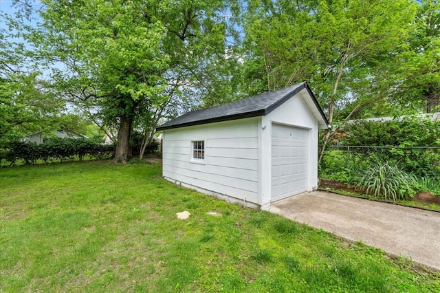 detached garage featuring driveway