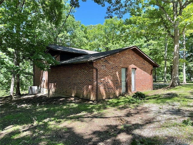 8305 Brouk Dr, Cedar Hill, MO 63016 - view of side of home with brick siding and central air condition unit
