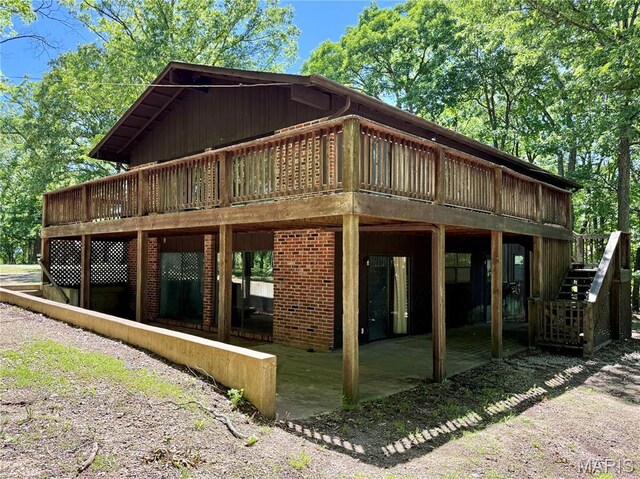 8305 Brouk Dr, Cedar Hill, MO 63016 - back of property with a deck, a patio, and stairs