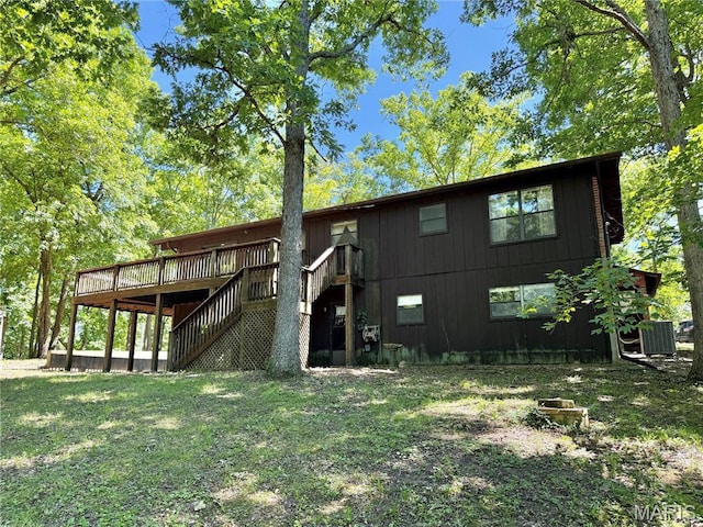 8305 Brouk Dr, Cedar Hill, MO 63016 - back of property with stairway, a wooden deck, and central air condition unit
