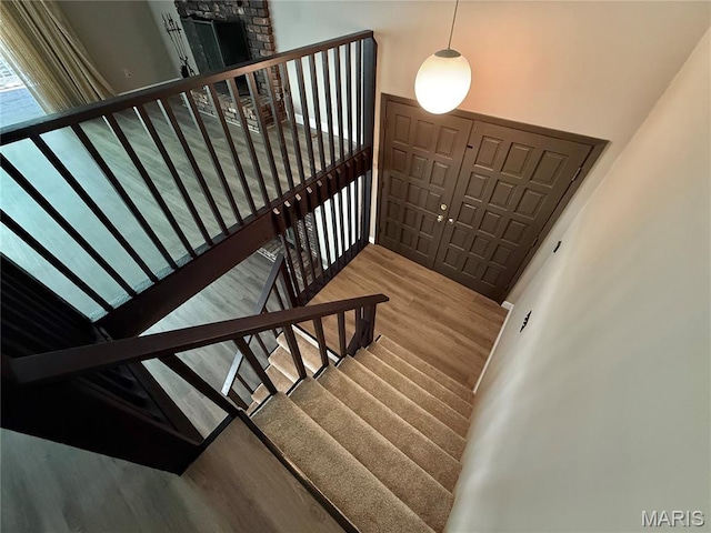 8305 Brouk Dr, Cedar Hill, MO 63016 - staircase with wood finished floors and a high ceiling