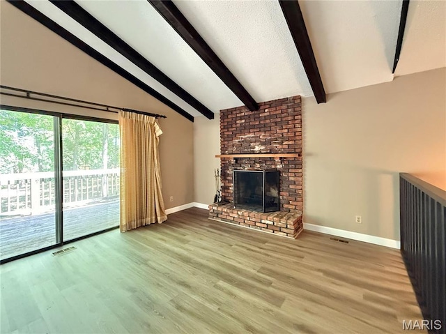 8305 Brouk Dr, Cedar Hill, MO 63016 - unfurnished living room with baseboards, wood finished floors, and a brick fireplace