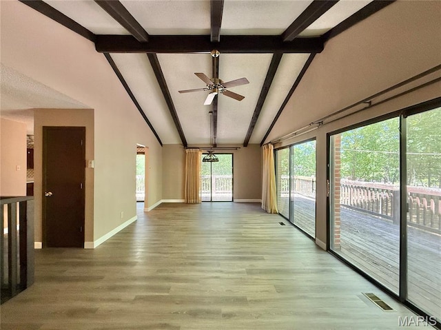 8305 Brouk Dr, Cedar Hill, MO 63016 - empty room with beam ceiling, baseboards, wood finished floors, high vaulted ceiling, and ceiling fan