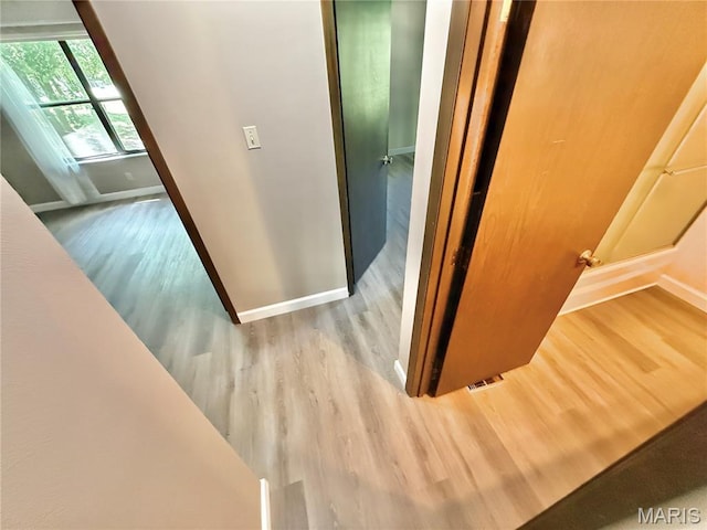 8305 Brouk Dr, Cedar Hill, MO 63016 - stairs with wood finished floors and baseboards