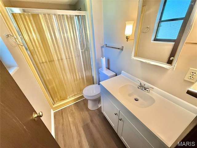 8305 Brouk Dr, Cedar Hill, MO 63016 - full bath with wood finished floors, a shower stall, vanity, and toilet