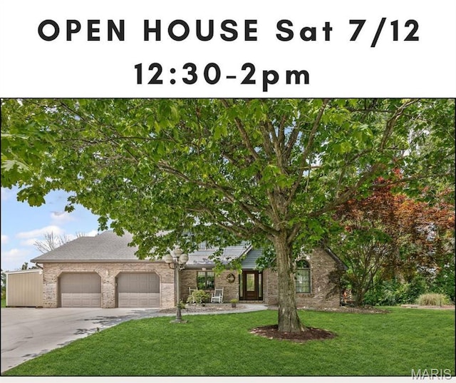 7 Tall Oaks Dr, Troy, IL 62294 - view of front of property featuring a garage, a front lawn, driveway, and brick siding
