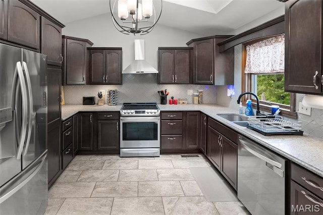 7 Tall Oaks Dr, Troy, IL 62294 - kitchen with stainless steel appliances, wall chimney range hood, a chandelier, lofted ceiling, and dark brown cabinets