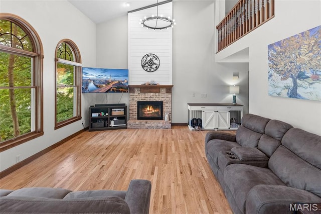 7 Tall Oaks Dr, Troy, IL 62294 - living room with high vaulted ceiling, light wood-type flooring, and a brick fireplace