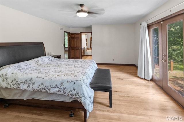 7 Tall Oaks Dr, Troy, IL 62294 - bedroom featuring access to exterior, french doors, multiple windows, and light wood-style floors