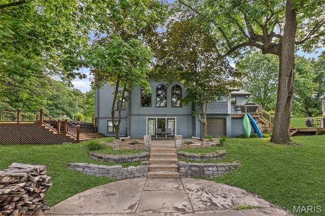 7 Tall Oaks Dr, Troy, IL 62294 - back of property featuring stairway, a deck, and a lawn
