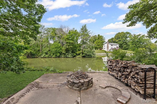 7 Tall Oaks Dr, Troy, IL 62294 - view of patio / terrace with an outdoor fire pit and a water view