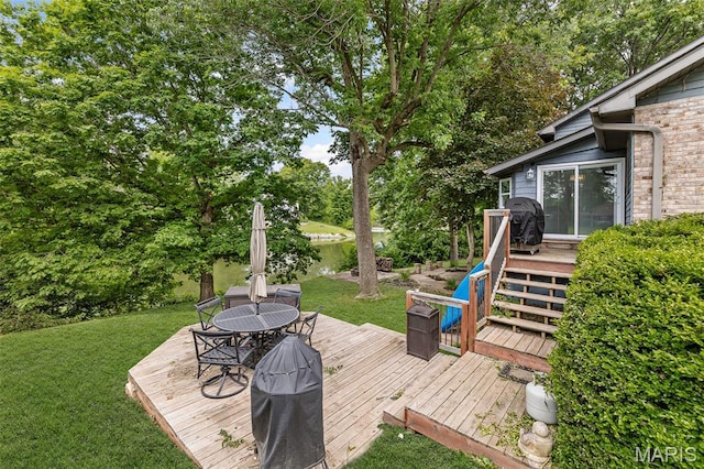7 Tall Oaks Dr, Troy, IL 62294 - deck with outdoor dining space, a yard, a water view, view of scattered trees, and area for grilling