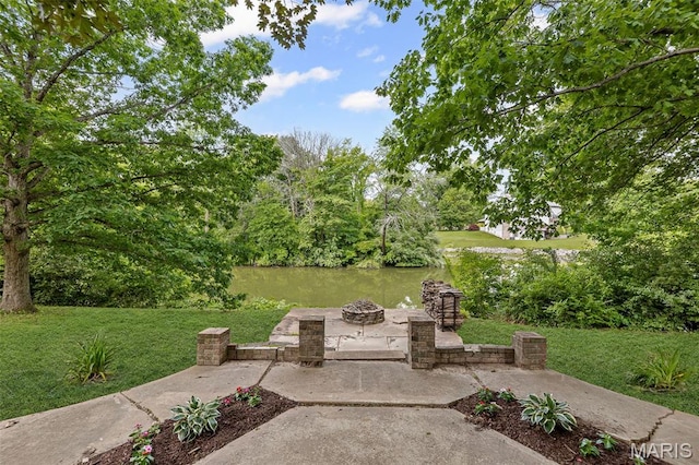 7 Tall Oaks Dr, Troy, IL 62294 - view of patio featuring an outdoor fire pit and a water view