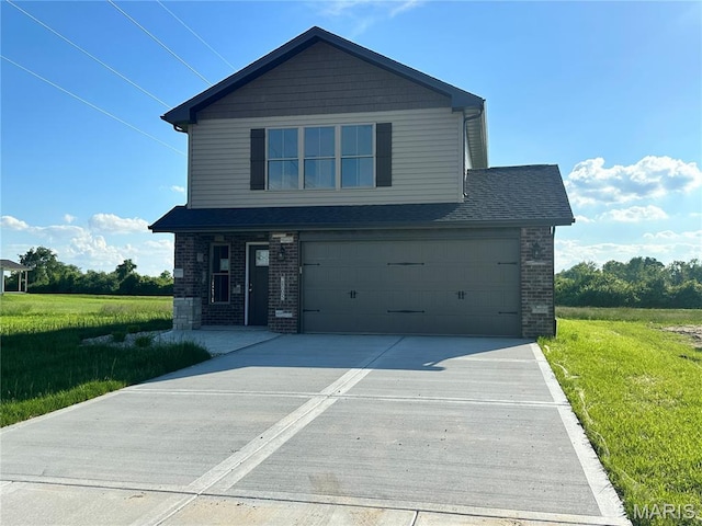 2805 Beth Ann Ct, Pontoon Beach, IL 62040 - view of front of home with brick siding, driveway, a front yard, and an attached garage