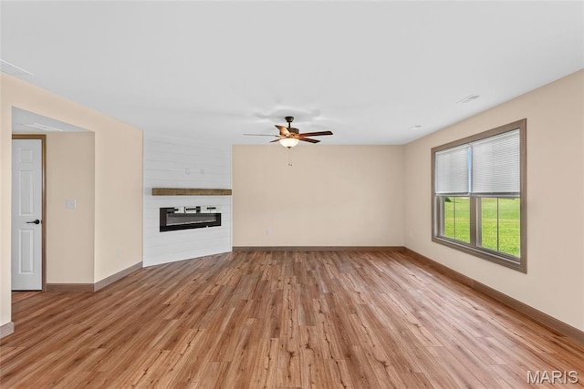 2805 Beth Ann Ct, Pontoon Beach, IL 62040 - unfurnished living room featuring light wood-style floors, baseboards, and a ceiling fan