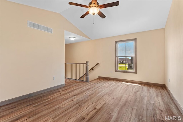 2805 Beth Ann Ct, Pontoon Beach, IL 62040 - spare room featuring ceiling fan, vaulted ceiling, wood finished floors, and baseboards