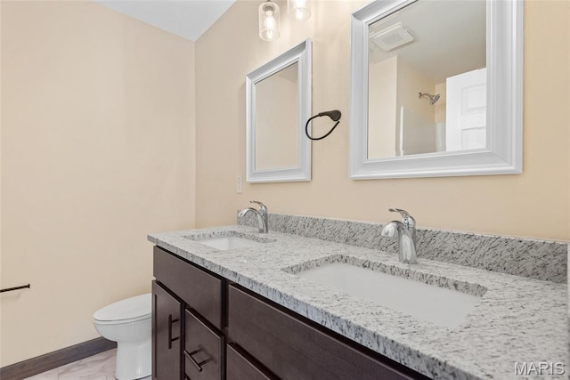 2805 Beth Ann Ct, Pontoon Beach, IL 62040 - bathroom featuring double vanity, toilet, and baseboards