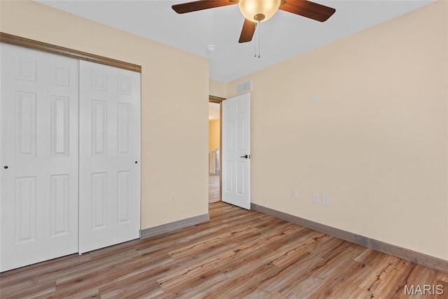 2805 Beth Ann Ct, Pontoon Beach, IL 62040 - unfurnished bedroom featuring baseboards, light wood finished floors, a closet, and ceiling fan