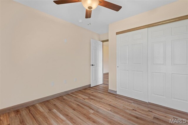 2805 Beth Ann Ct, Pontoon Beach, IL 62040 - unfurnished bedroom with light wood-type flooring, baseboards, a closet, and a ceiling fan