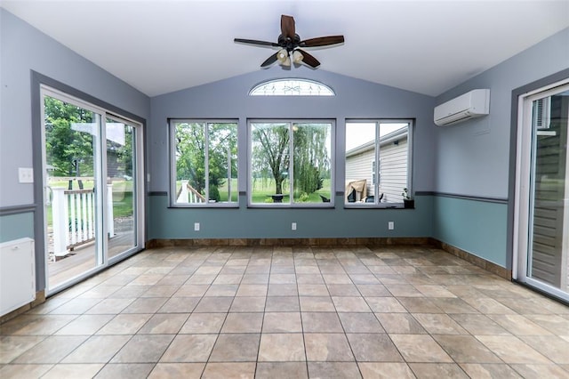 unfurnished room with a wall mounted AC, lofted ceiling, a ceiling fan, light tile patterned floors, and baseboards