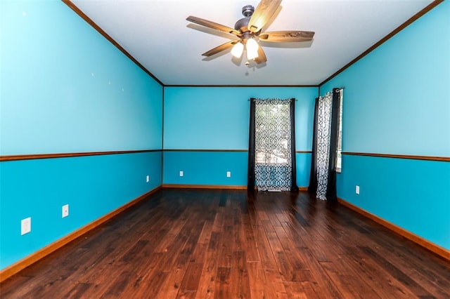 empty room featuring ceiling fan, ornamental molding, hardwood / wood-style floors, and baseboards