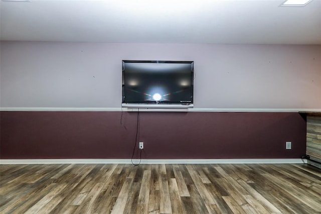 unfurnished living room with wood finished floors
