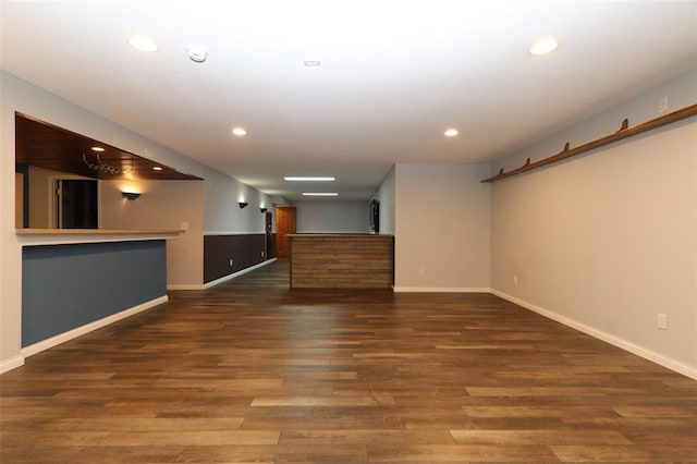spare room featuring recessed lighting, baseboards, wood finished floors, and a smoke detector
